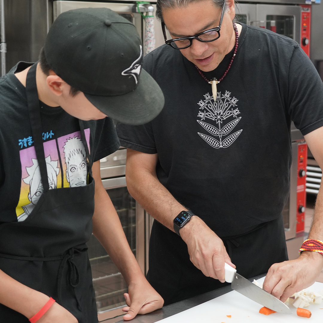 Chef Sean Sherman, Oglala Lakota, addresses the audience during the USDA Indigenous Food Sovereignty Resources at White House Tribal Youth Forum at the U.S. Department of Health and Human Services headquarter in Washington D.C.