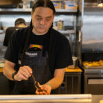 Chef Sean Sherman, The Sioux Chef, owner and chef at Owamni prepares cricket, an ingredient used in Owamni Cricket Seed Mix menu item at Owamni in Minneapolis, Minnesota